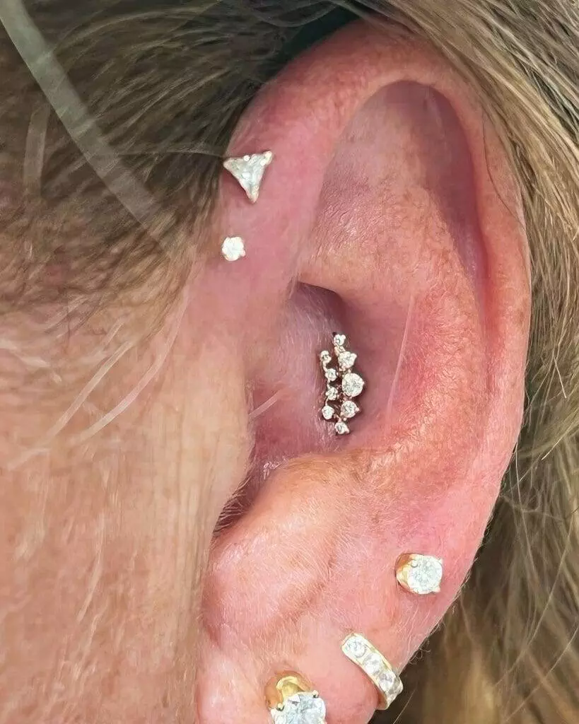 Ronnie Shaw's ear with a diamond ear piercing.