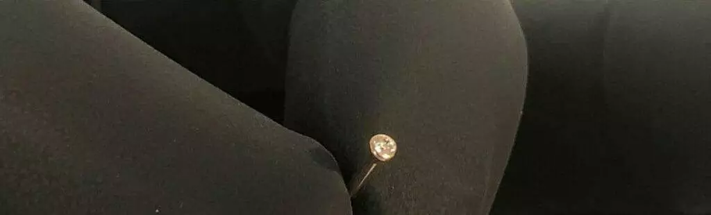 Black pants with a diamond pierce on them.