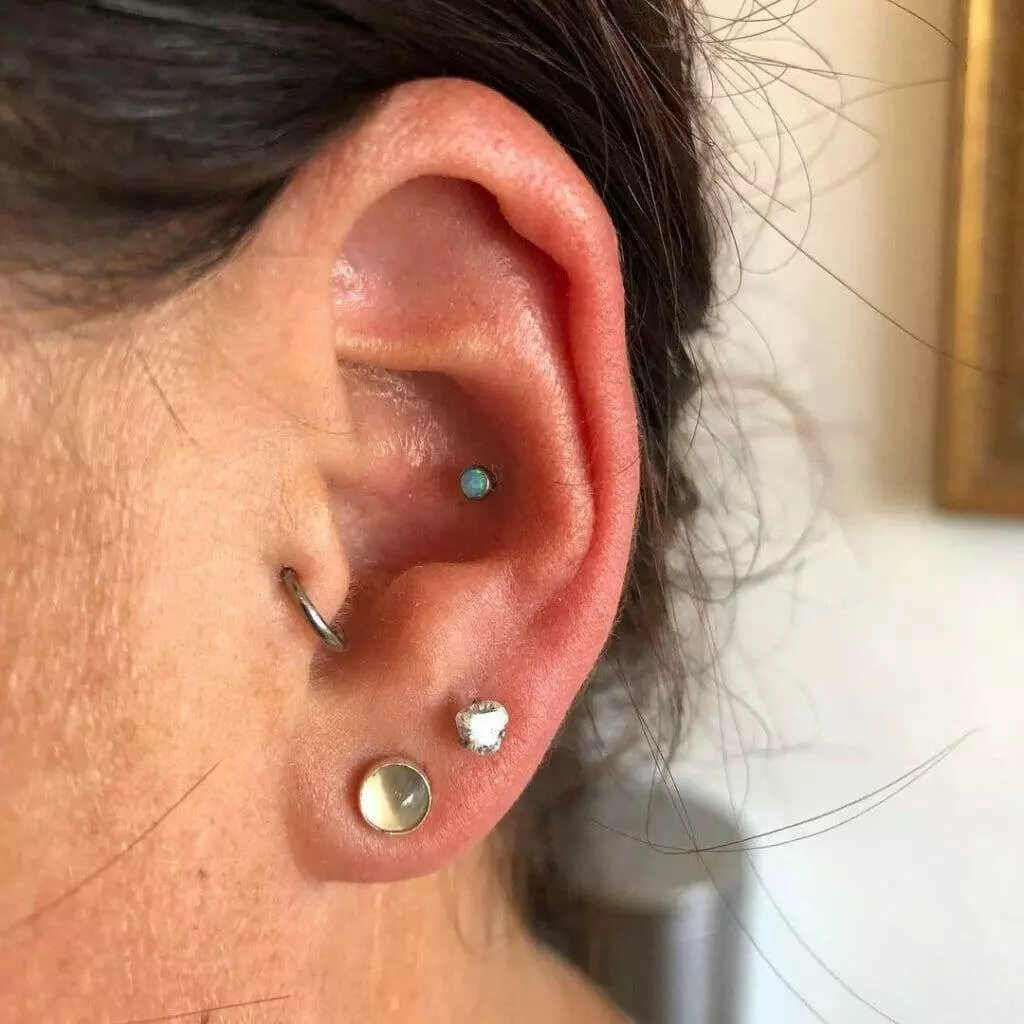 A woman's ear with dual piercings.